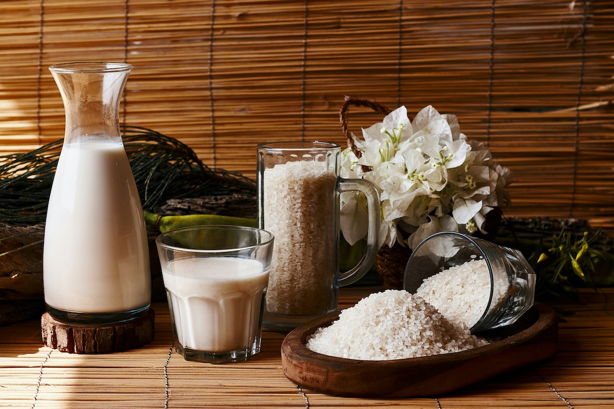 Protein powder, oat milk, and ingredients laid out on counter